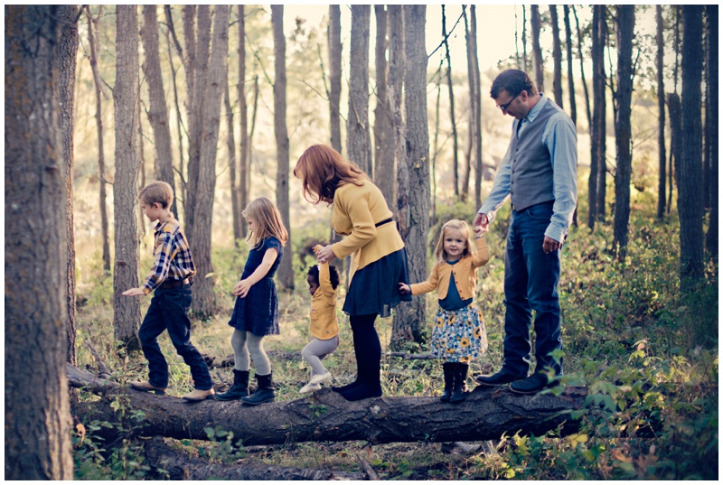 photo of a family walking in the woods